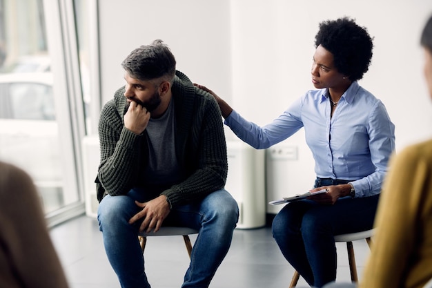 Therapy session — individuals and families receiving compassionate support